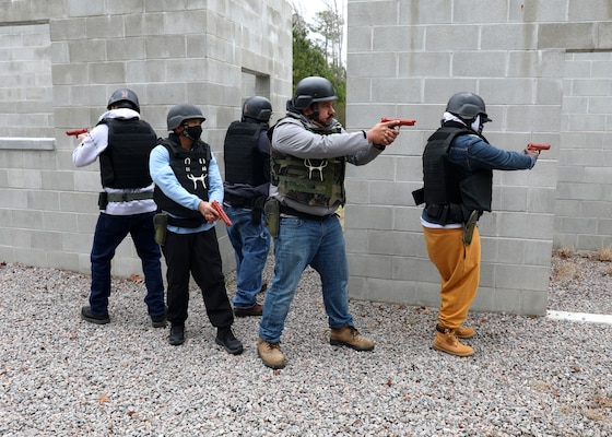 Civil Service Mariners practice clearing spaces of simulated security threats at the Military Sealift Command Training Center East on Joint Base Langley-Fort Eustis, Virginia, Feb. 24.