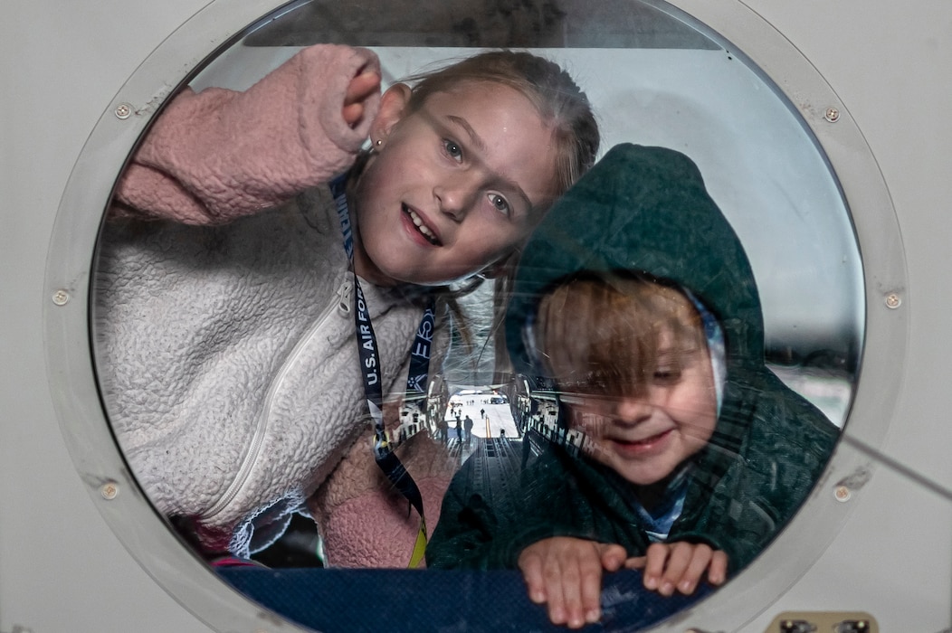 photo of children in a window