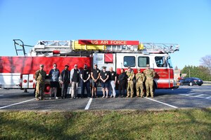 Joint Base Andrews community members pose for a photo after participating in a self-paced 5K in honor of responders on JBA, Md., March 18, 2022. The JBA Chapel hosted the 5K to honor fallen firefighters and an Anne Arundel County firefighter battling amyotrophic lateral sclerosis, or ALS. (U.S. Air Force photo by Senior Airman Essence Myricks)