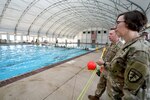 U.S. Army Command Sgt. Maj. JoAnn Naumann, command senior enlisted leader, U.S. Special Operations Command, Korea (right) speaks with U.S. Air Force Master Sgt. Michael Perolio, Special Warfare Training Flight Superintendent, (left) about the Assessment and Selection process for Air Force Special Warefare candidates at Joint Base San Anotnio, TX, Mar. 16, 2022. Naumann visited the area to mentor the NCOs and observe the SWTW Assessment and Selection process. (U.S. Air Force photo by Brian Boisvert)