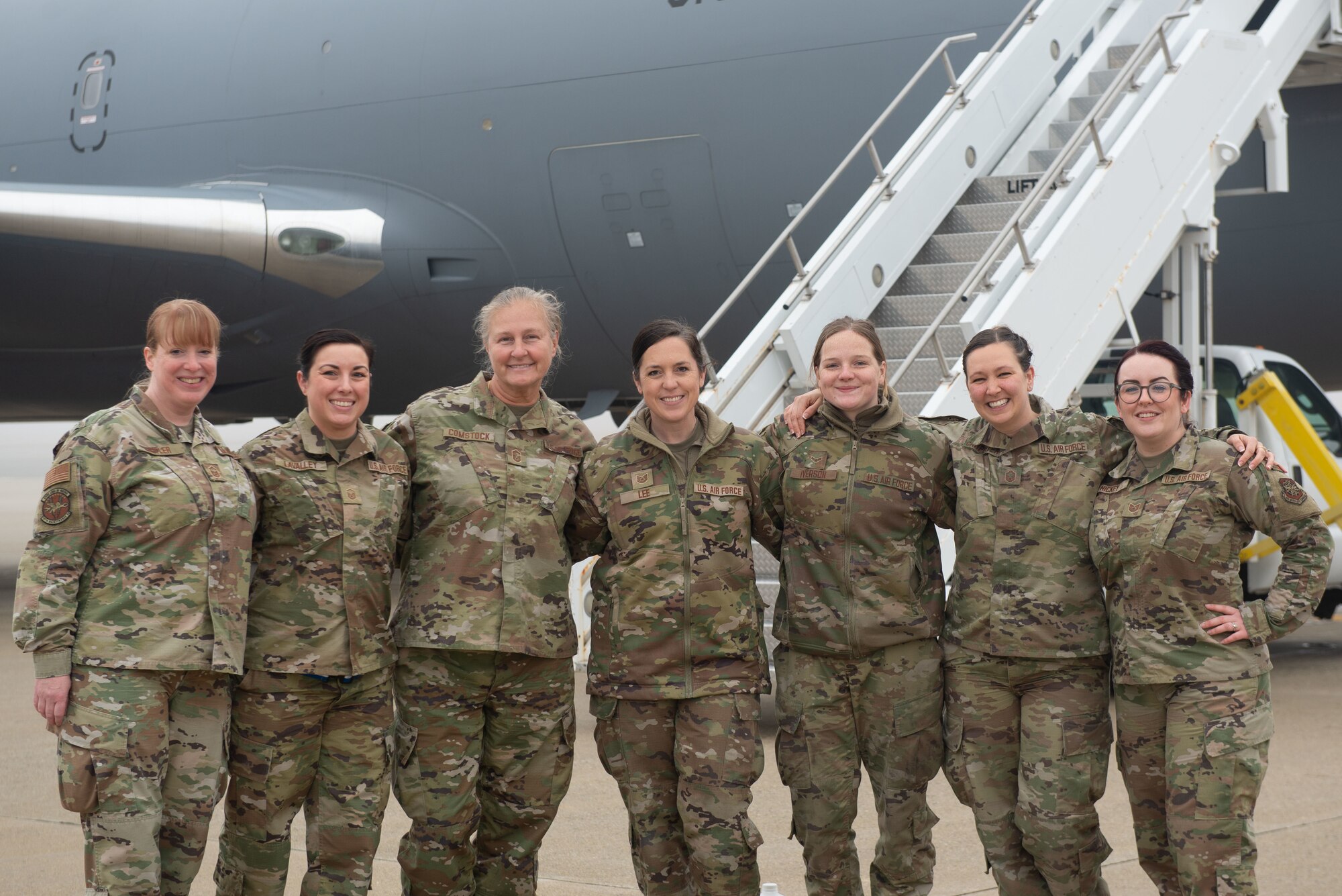 Ground crew stand in front of a KC-46 on the Pease flight line.
