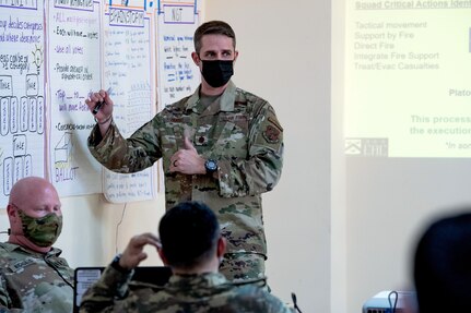 man presents information on posters