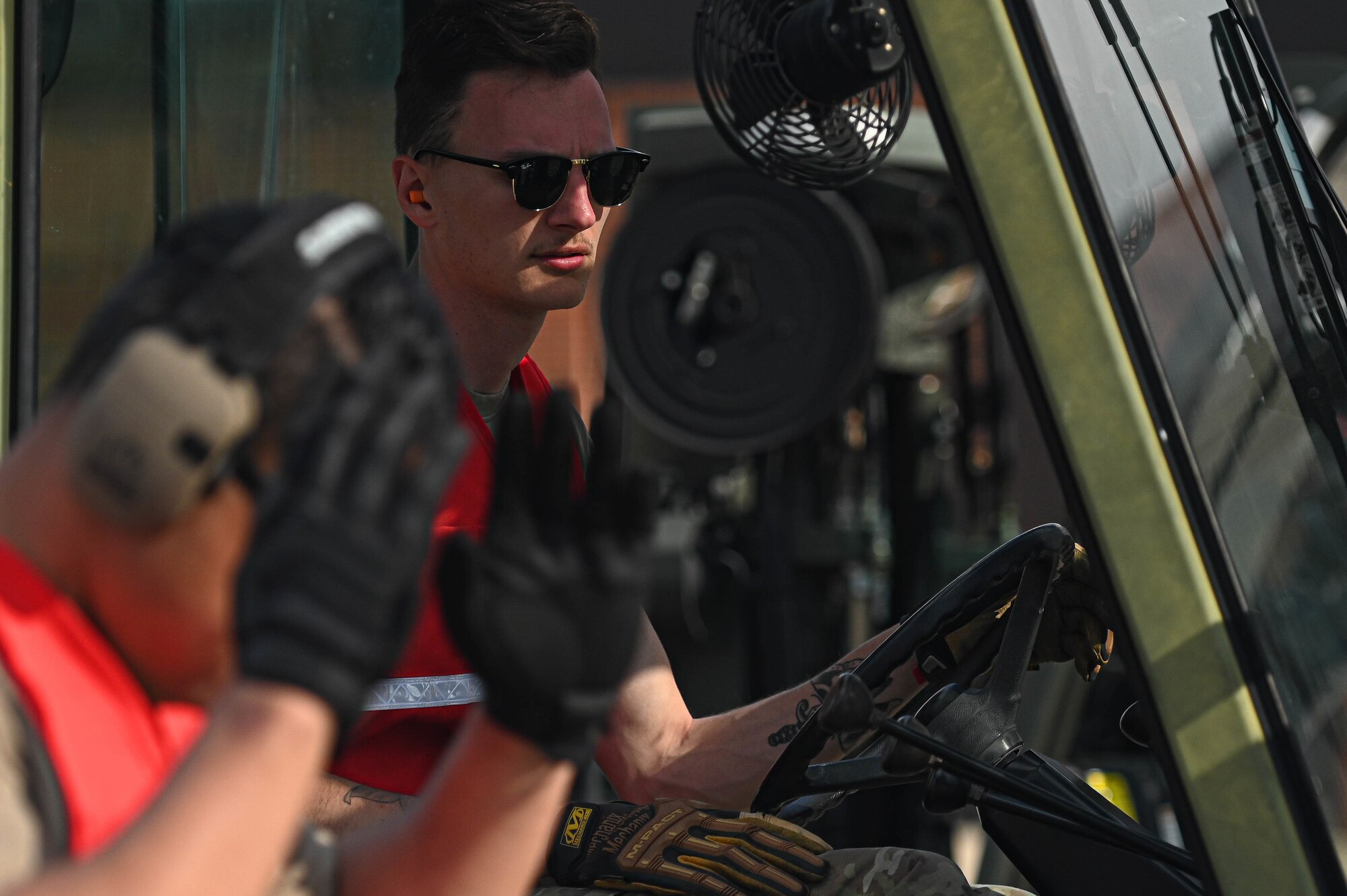 Senior Airman Jonathan Simmons, 375th Logistics Readiness Squadron ground transportation operator, parks a forklift after loading pallets on a flightline during a deployment rehearsal on Scott Air Force Base, Illinois, March 17, 2022. This deployment mobility rehearsal emphasizes readiness of command and control procedures and continuity of operations in a simulated contested environment. (U.S. Air Force photo by Airman 1st Class Mark Sulaica)