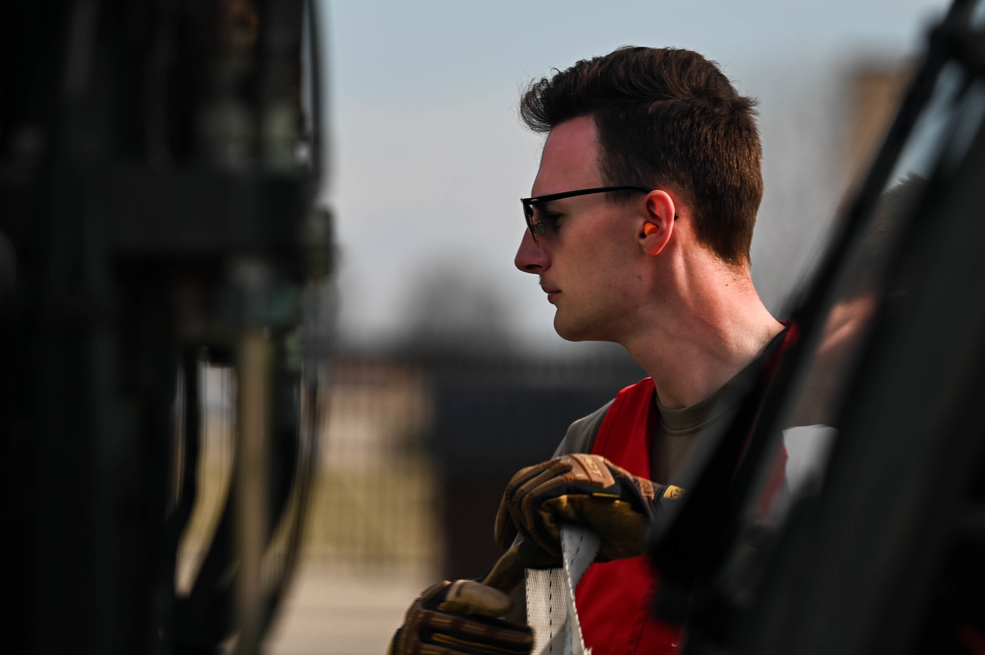 Senior Airman Jonathan Simmons, 375th Logistics Readiness Squadron ground transportation operator, fastens cargo on a forklift during a deployment rehearsal on Scott Air Force Base, Illinois, March 17, 2022. This deployment mobility rehearsal emphasizes readiness of command and control procedures and continuity of operations in a simulated contested environment. (U.S. Air Force photo by Airman 1st Class Mark Sulaica)