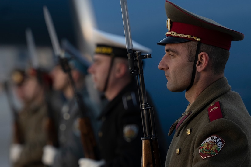 Troops stand in formation.