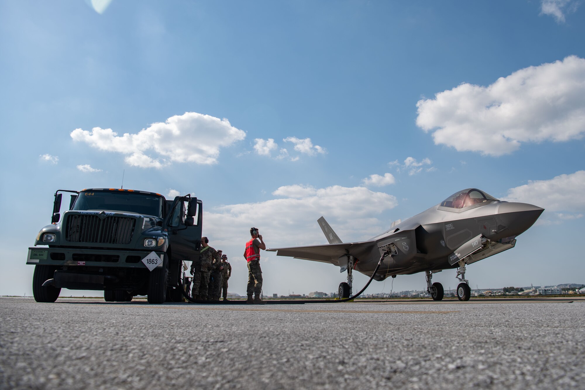 Airmen and Marines conduct hot pit refueling on a F-35A Lightning II.