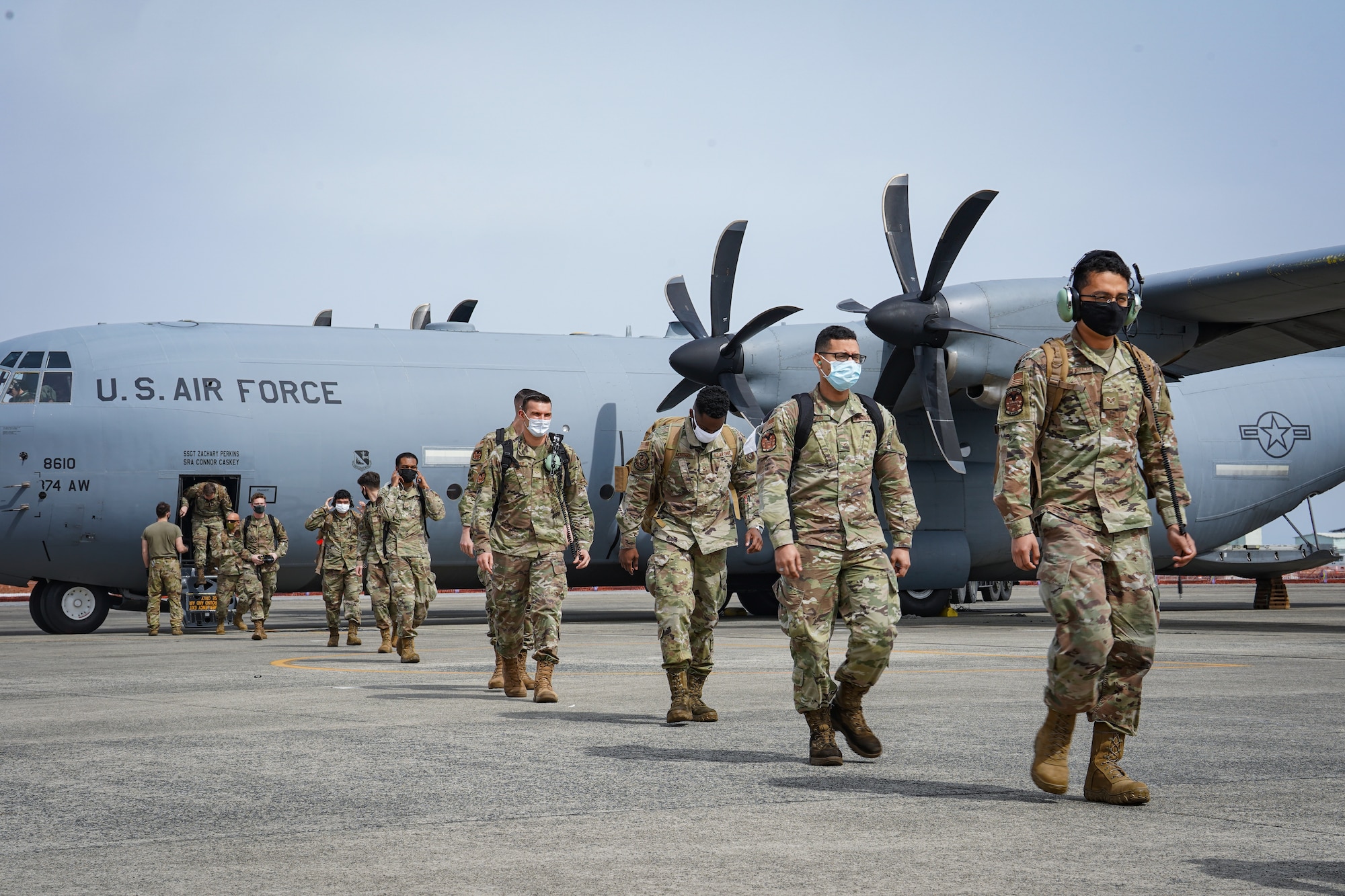 U.S. Air Force Airmen from the 18th Wing, Kadena Air Base, Japan unload from a C-130J Super Hercules assigned to the 36th Airlift Squadron, Yokota Air Base, Japan in support of the aviation training relocation program, March 17, 2022. ATR is a result of the May 2006 United States-Japan roadmap for realignment implementation, a bilateral program aimed at increasing operational readiness and improving interoperability. (U.S. Air Force photo by Staff Sgt. Kyle Johnson)