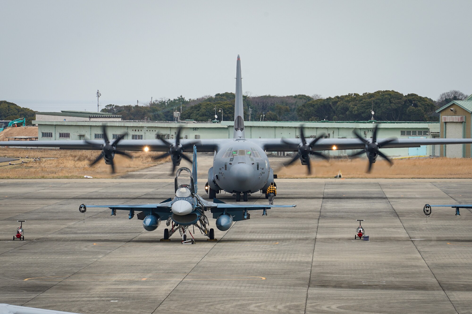 A U.S. Air Force C-130J Super Hercules assigned to the 36th Airlift Squadron, Yokota Air Base, Japan parks at Japan Air Self-Defense Force Tsuiki Air Base, Fukuoka, Japan as part of the aviation training relocation program March 17, 2022. ATR is a result of the May 2006 United States-Japan roadmap for realignment implementation, a bilateral program aimed at increasing operational readiness and improving interoperability. (U.S. Air Force photo by Staff Sgt. Kyle Johnson)