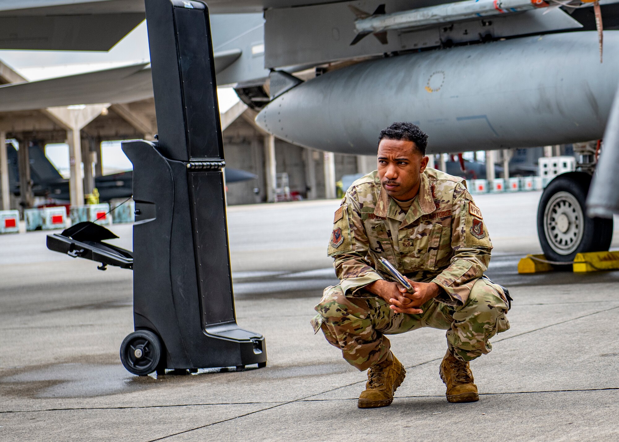 An Airman observes a competition