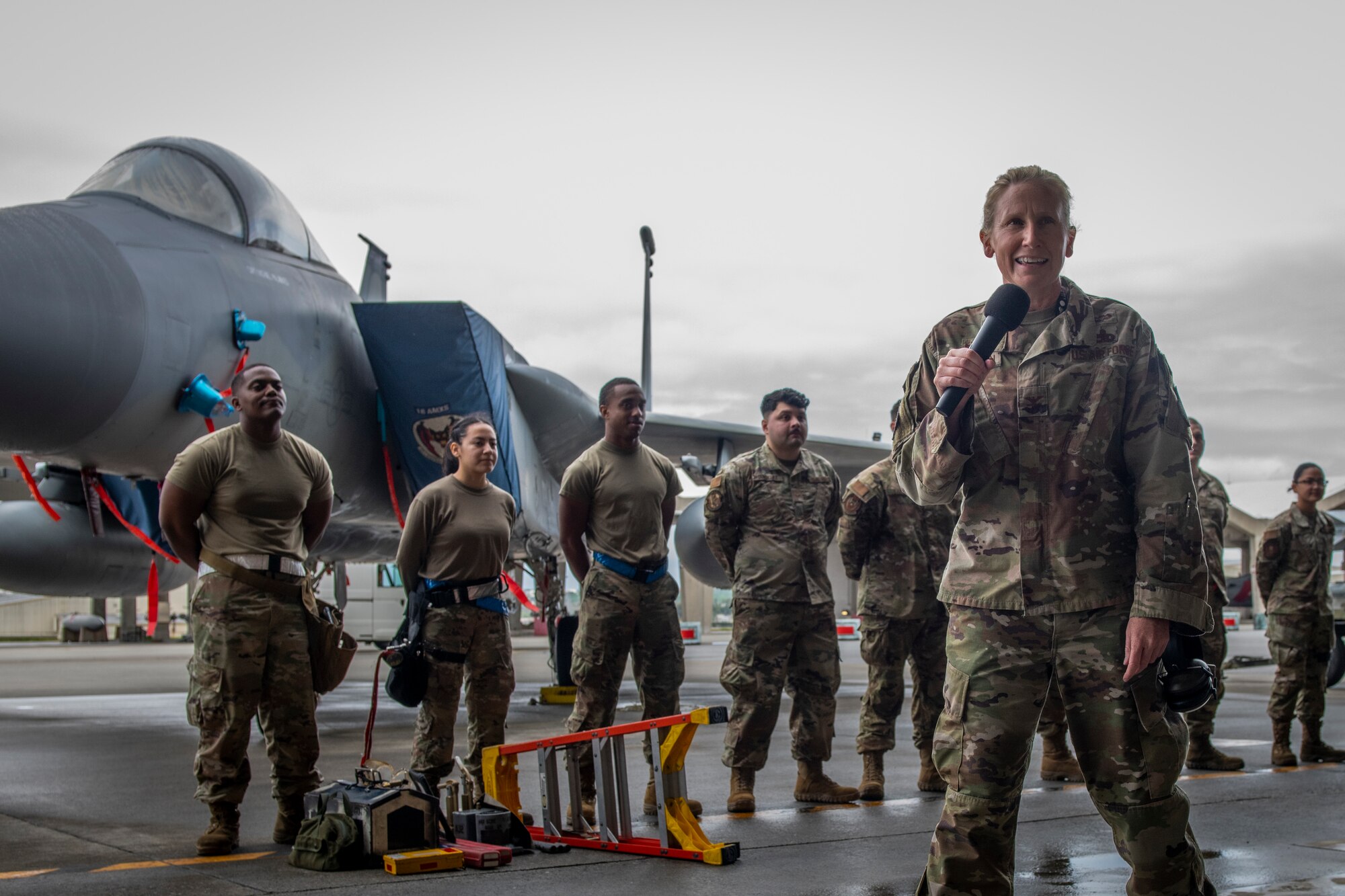 A group commander addresses a crowd during a completion