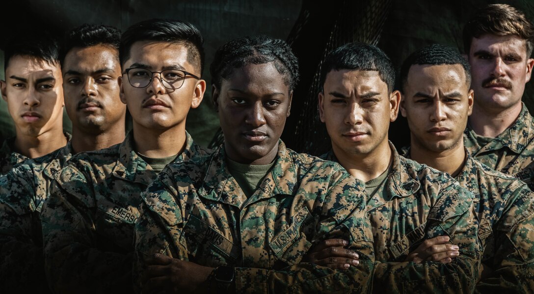 U.S. Marines with 3d Landing Support Battalion, Combat Logistics Regiment 3, 3d Marine Logistics Group, pose for a photo on Camp Foster, Okinawa, Japan, Mar. 7, 2022. Davis, a Spanishtown, Jamaica native, joined the Marine Corps in 2019. Now at the rank of Corporal, she continues to be a diligent leader by striving to mirror her mother's guidance and wisdom towards her Marines. (U.S. Marine Corps photo by Lance Cpl. Jonathan Beauchamp)
