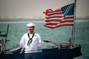 220321-N-KZ419-1511 MANAMA, Bahrain (March 21, 2022) Electrician’s Mate Fireman Luis Salcedo stands at parade rest aboard the patrol coastal ship USS Whirlwind (PC 11) during the ship's decommissioning ceremony March 21, at Naval Support Activity Bahrain.