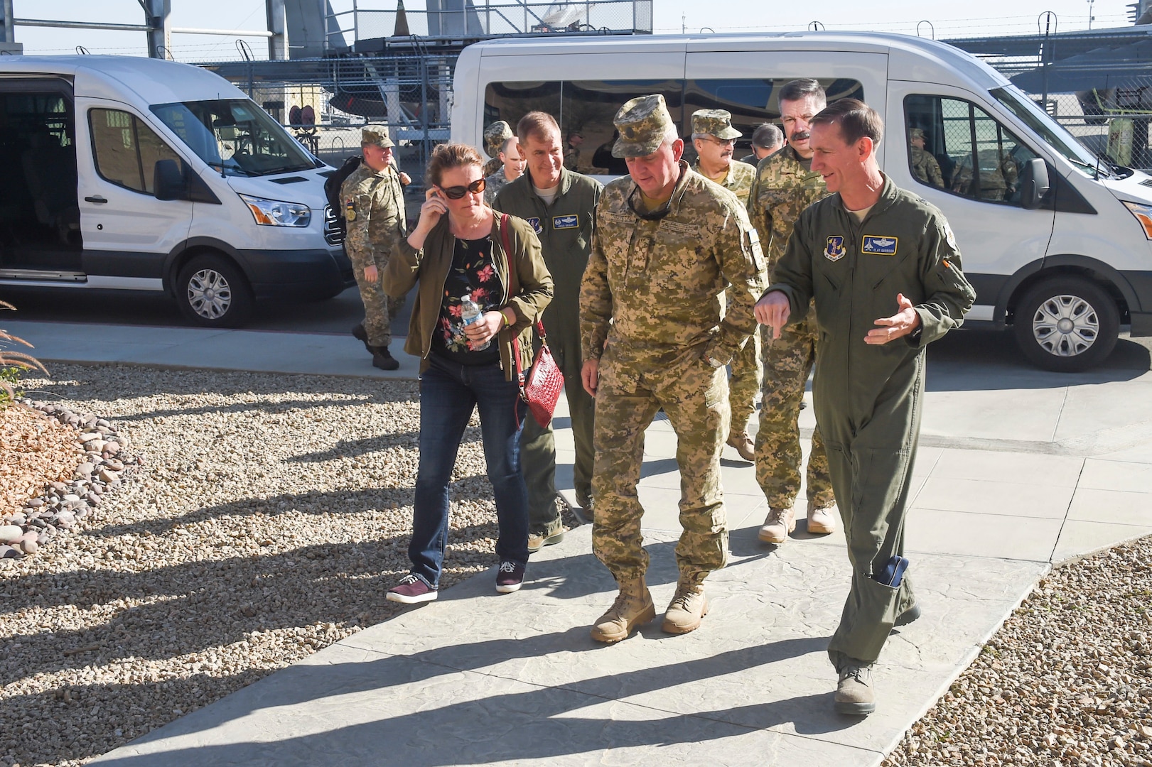 U.S. Air Force Brig. Gen. Clay Garrison, California Air National Guard commander, discusses operations with Ukraine General Viktor Muzhenko, Chief of the General Staff of the Armed Forces of Ukraine, while walking to the operations building for the first briefing during their State Partnership Program visit to the 144th Fighter Wing Oct. 26, 2017. The purpose of the SPP is to enhance military ties and strengthen partnerships with nations around the world.