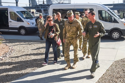 U.S. Air Force Brig. Gen. Clay Garrison, California Air National Guard commander, discusses operations with Ukraine General Viktor Muzhenko, Chief of the General Staff of the Armed Forces of Ukraine, while walking to the operations building for the first briefing during their State Partnership Program visit to the 144th Fighter Wing Oct. 26, 2017. The purpose of the SPP is to enhance military ties and strengthen partnerships with nations around the world.