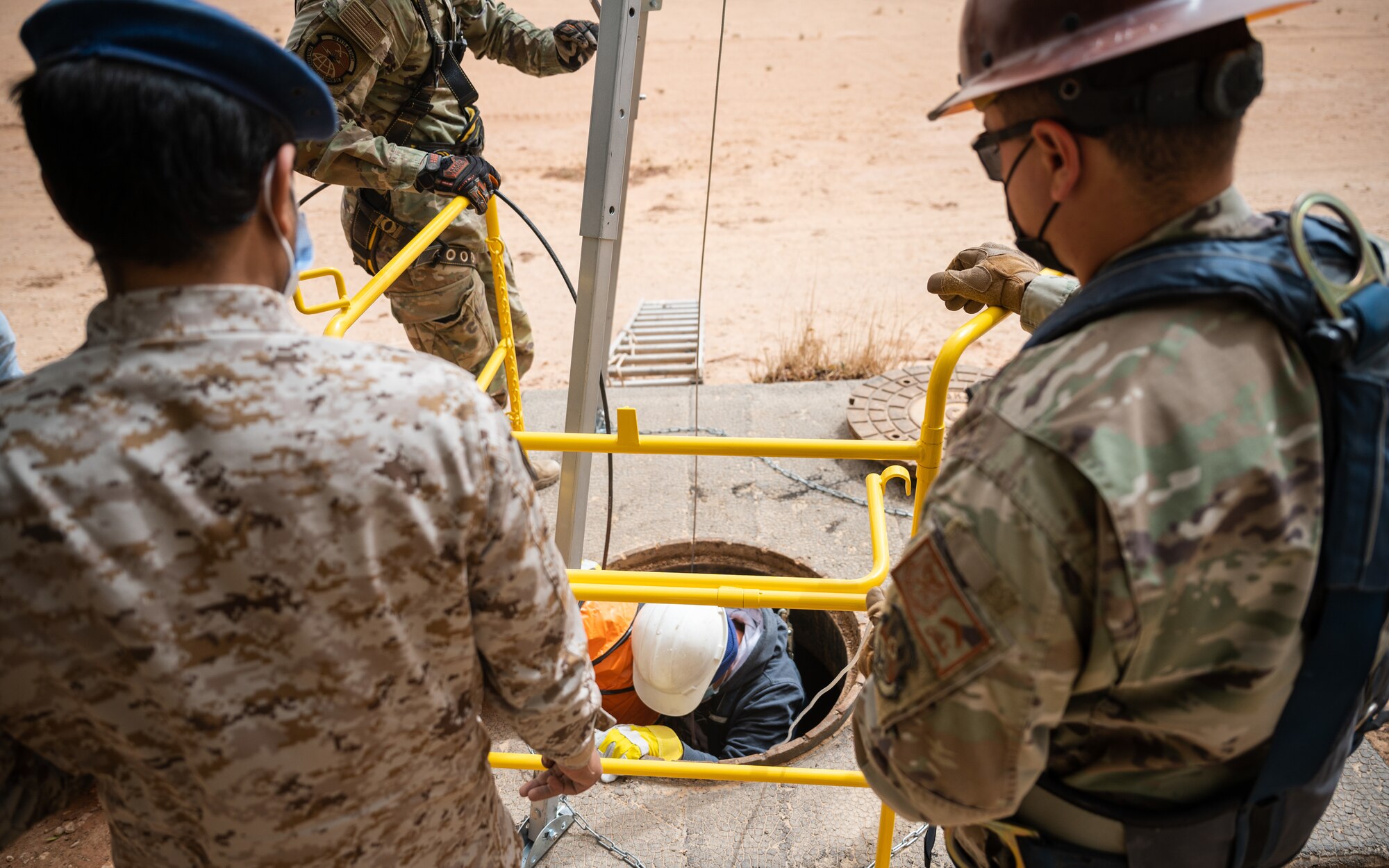 Service members from the U.S. and Royal Saudi Air Forces perform a fiber optic repair at Prince Sultan Air Base, Kingdom of Saudi Arabia, March 17, 2022. Training alongside RSAF partners contributes to developing the capabilities and skills of base personnel in operational and combat environments. (U.S. Air Force photo by Senior Airman Jacob B. Wrightsman)