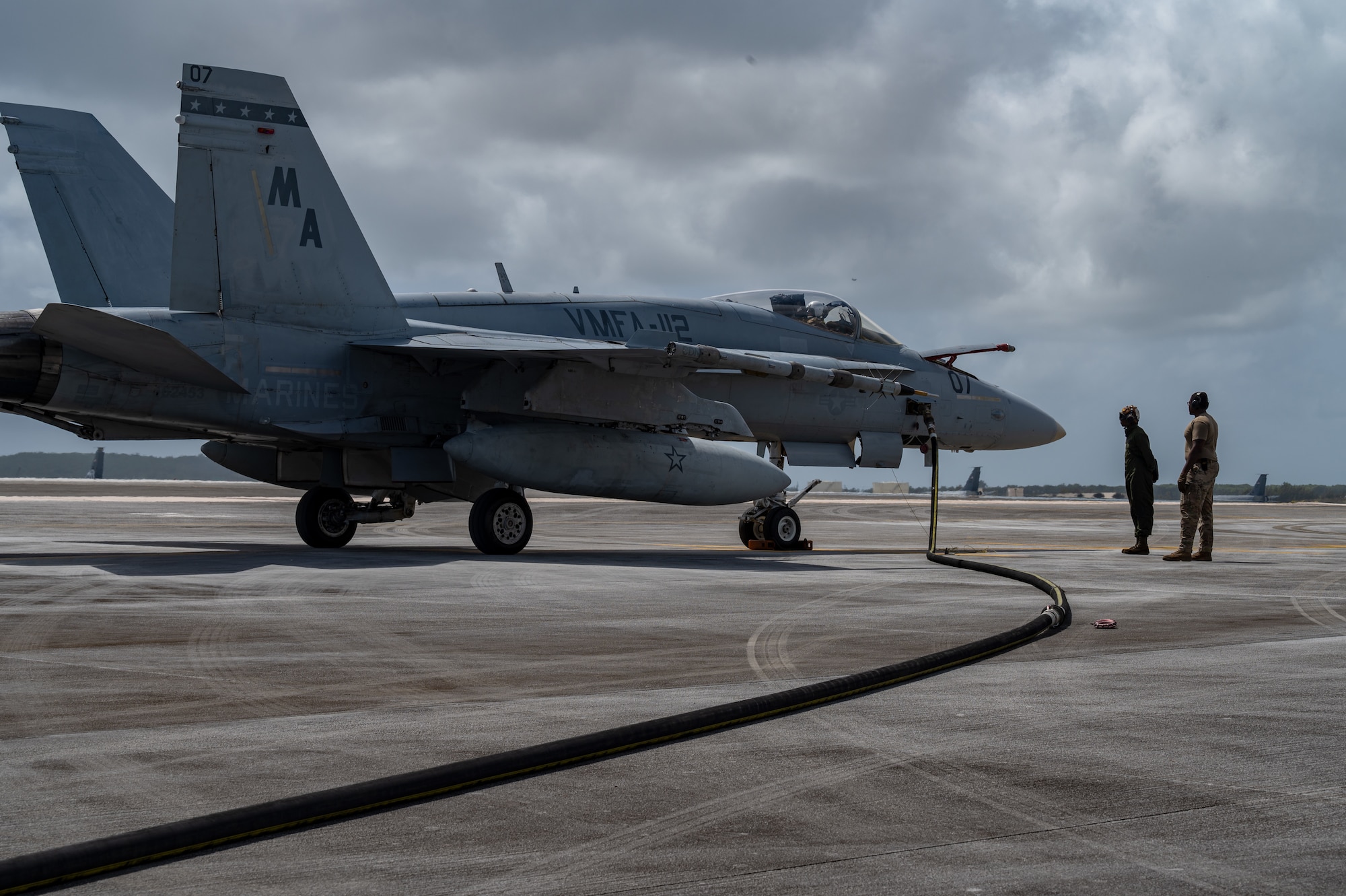 A Marine Fighter F/A-18C Hornet is being refueled during a hot-pit training exercise at Andersen Air Force Base, Guam, Feb. 14, 2022.