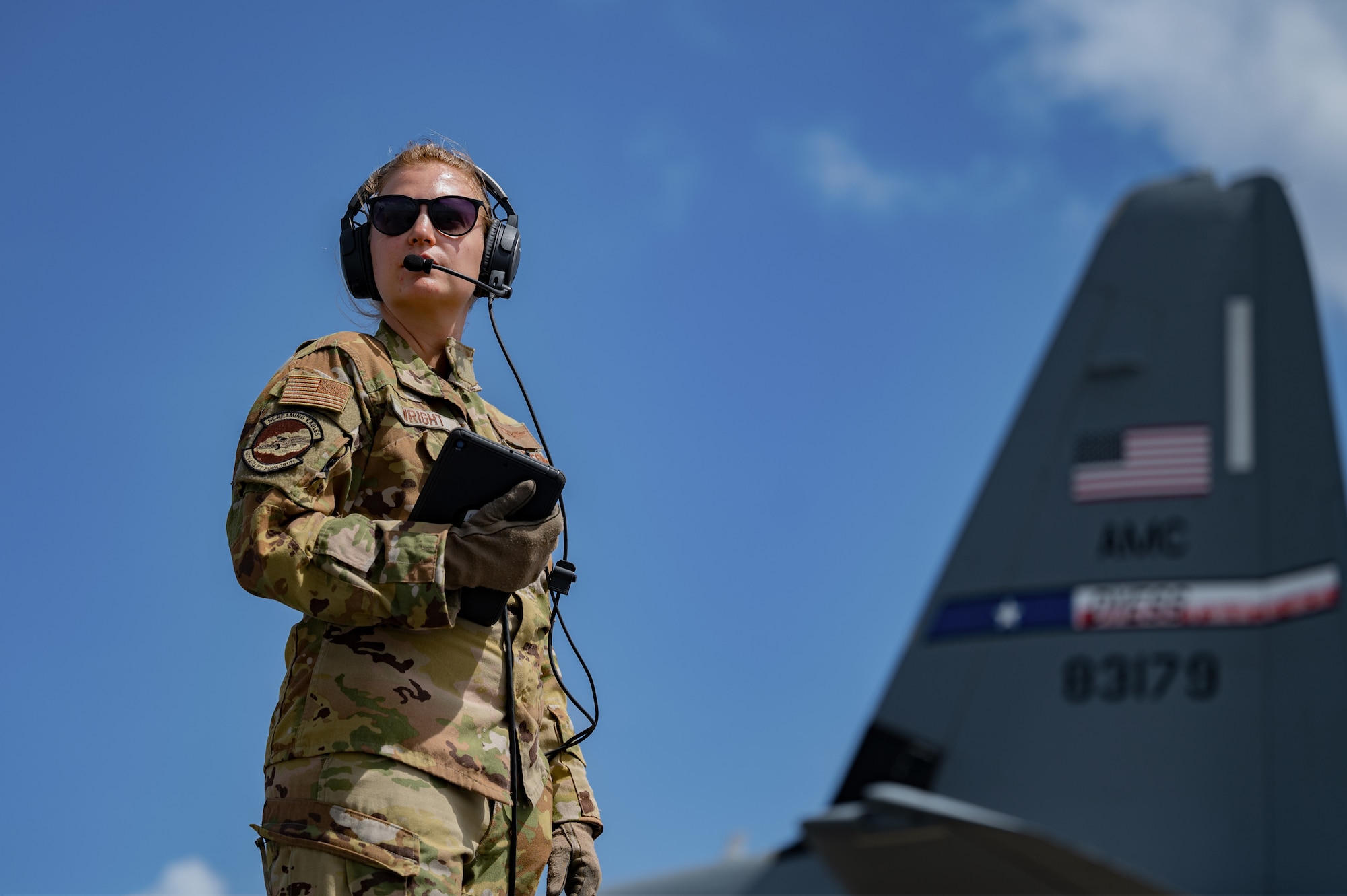 Staff Sgt. Gabby Wright, 40th Airlift Squadron loadmaster, aids in helping with a hot pit refueling at Andersen Air Force Base, Guam, Feb. 14, 2022.