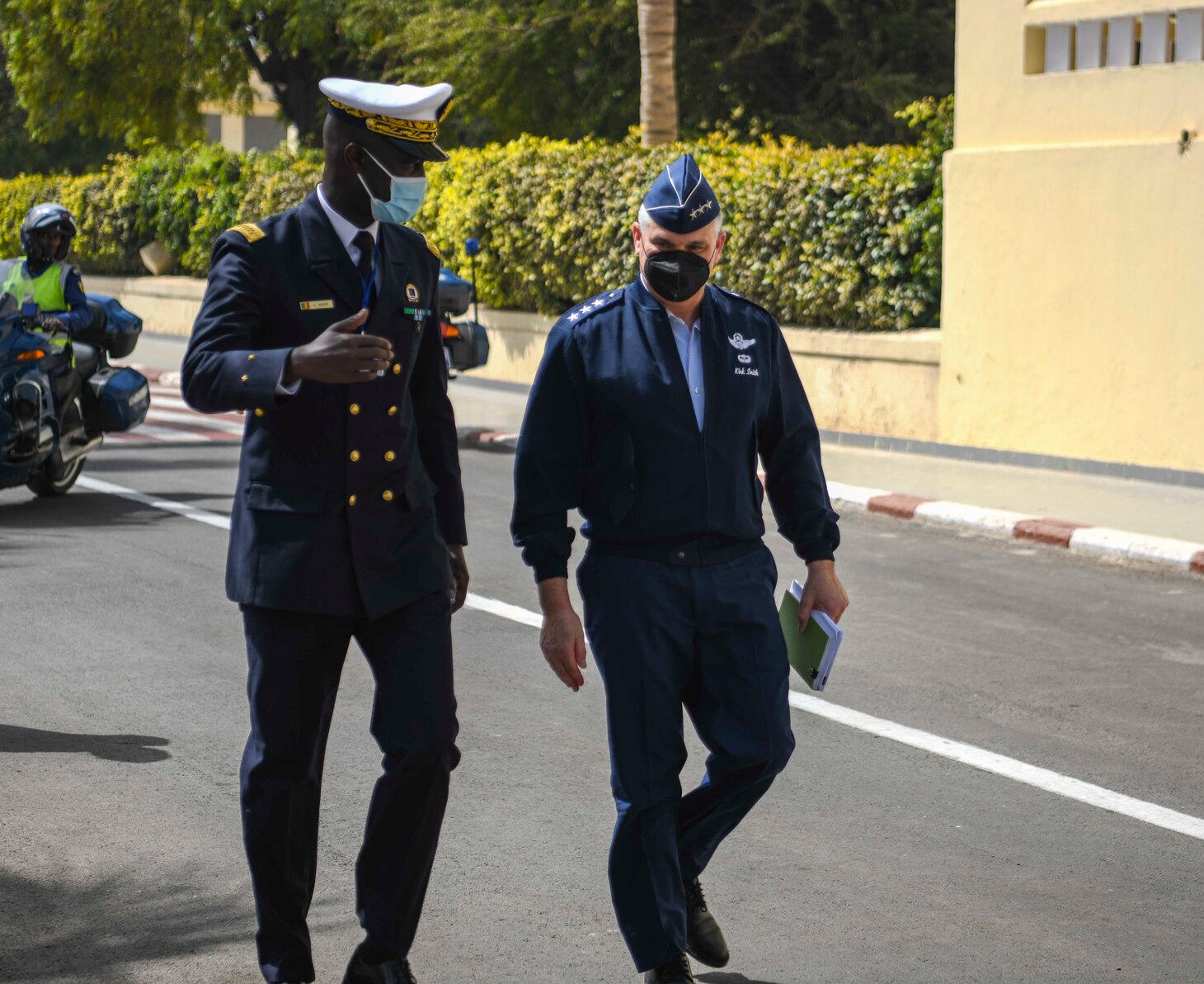 U.S. Air Force Lt. Gen. Kirk Smith, deputy commander, U.S. Africa Command, right, walks with Rear Adm. Oumar Wade, Senegalese Chief of Navy, at the Senegalese Naval Headquarters, in Dakar, Senegal, during the closing ceremony of Exercise Obangame Express 2022, Mar. 18, 2022.