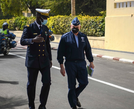 U.S. Air Force Lt. Gen. Kirk Smith, deputy commander, U.S. Africa Command, right, walks with Rear Adm. Oumar Wade, Senegalese Chief of Navy, at the Senegalese Naval Headquarters, in Dakar, Senegal, during the closing ceremony of Exercise Obangame Express 2022, Mar. 18, 2022.