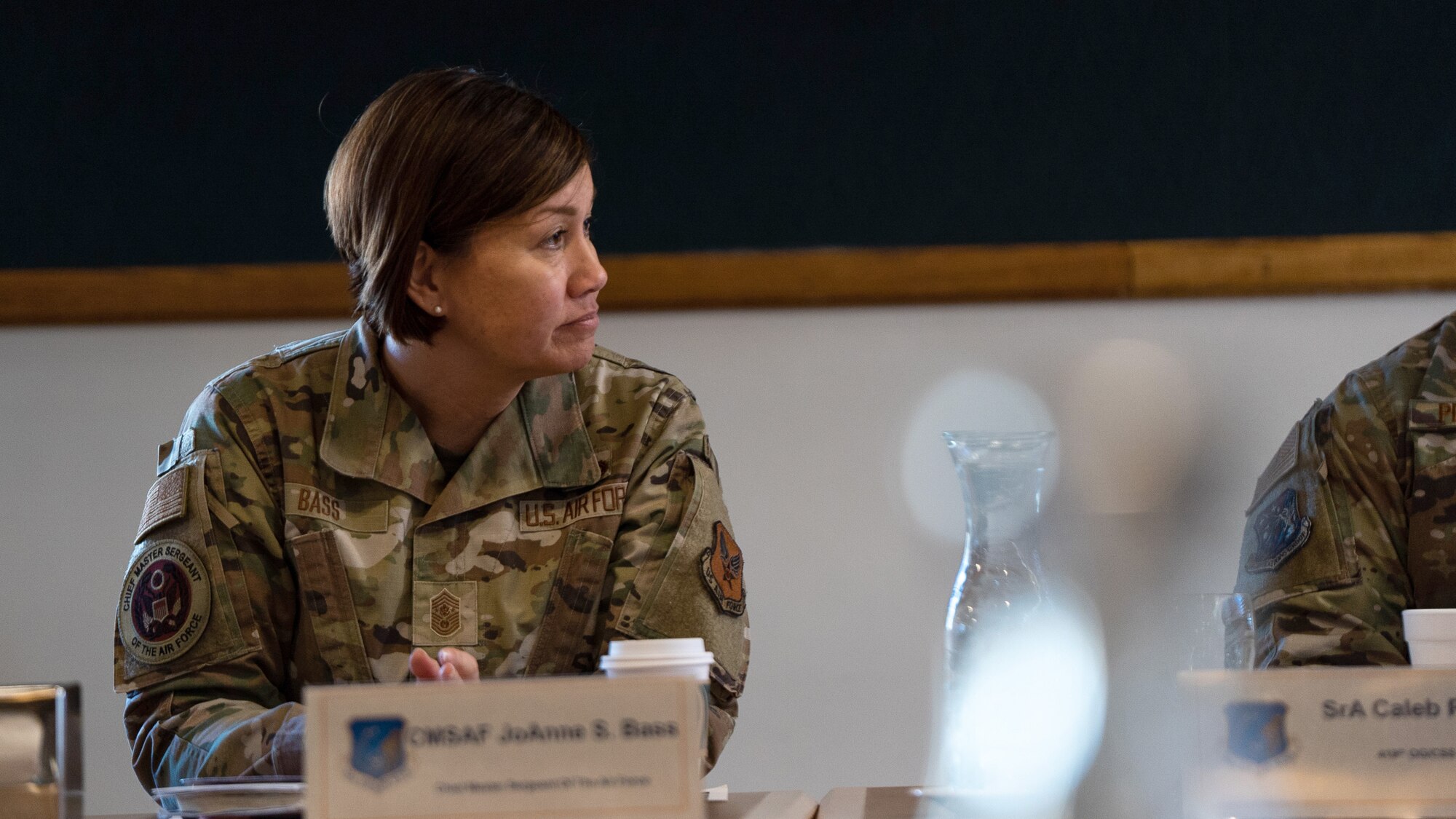 Chief Master Sergeant of the Air Force JoAnne S. Bass sits at a table.