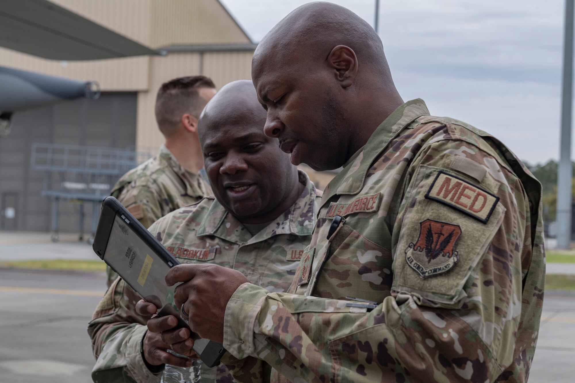 Photo of an Airman reviewing scores