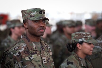 U.S. Illinois Army National Guard Capt. Aaron Deal, 404th Maneuver Enhancement Brigade, waits to receive his combat patch, a military milestone earned while serving in hostile conditions, March 17, 2022.