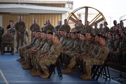 Members of the 404th Maneuver Enhancement Brigade listen to Maj. Gen. William Zana, commanding general of Combined Joint Task Force - Horn of Africa