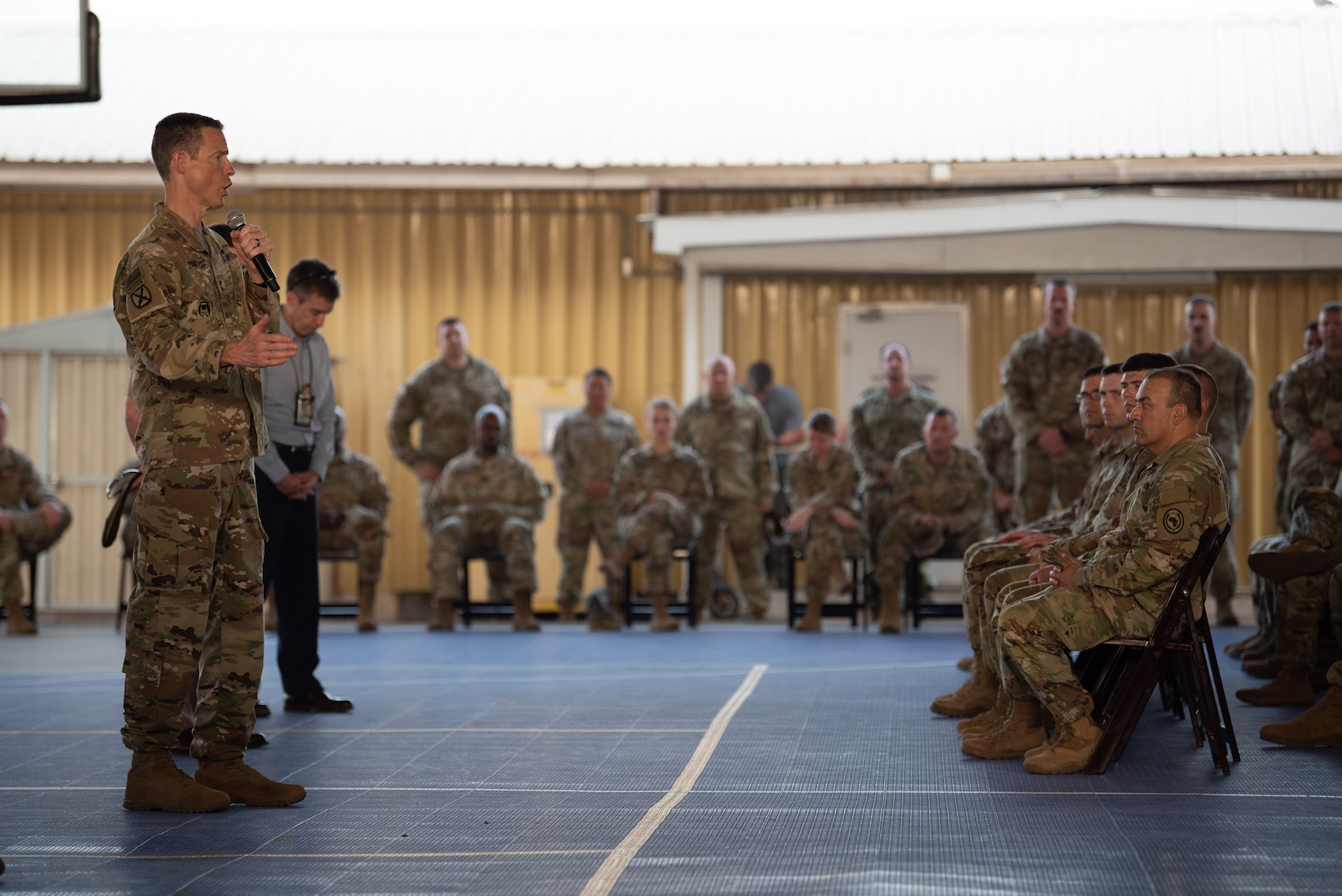 Members of the 404th Maneuver Enhancement Brigade listen to Maj. Gen. William Zana, commanding general of Combined Joint Task Force - Horn of Africa
