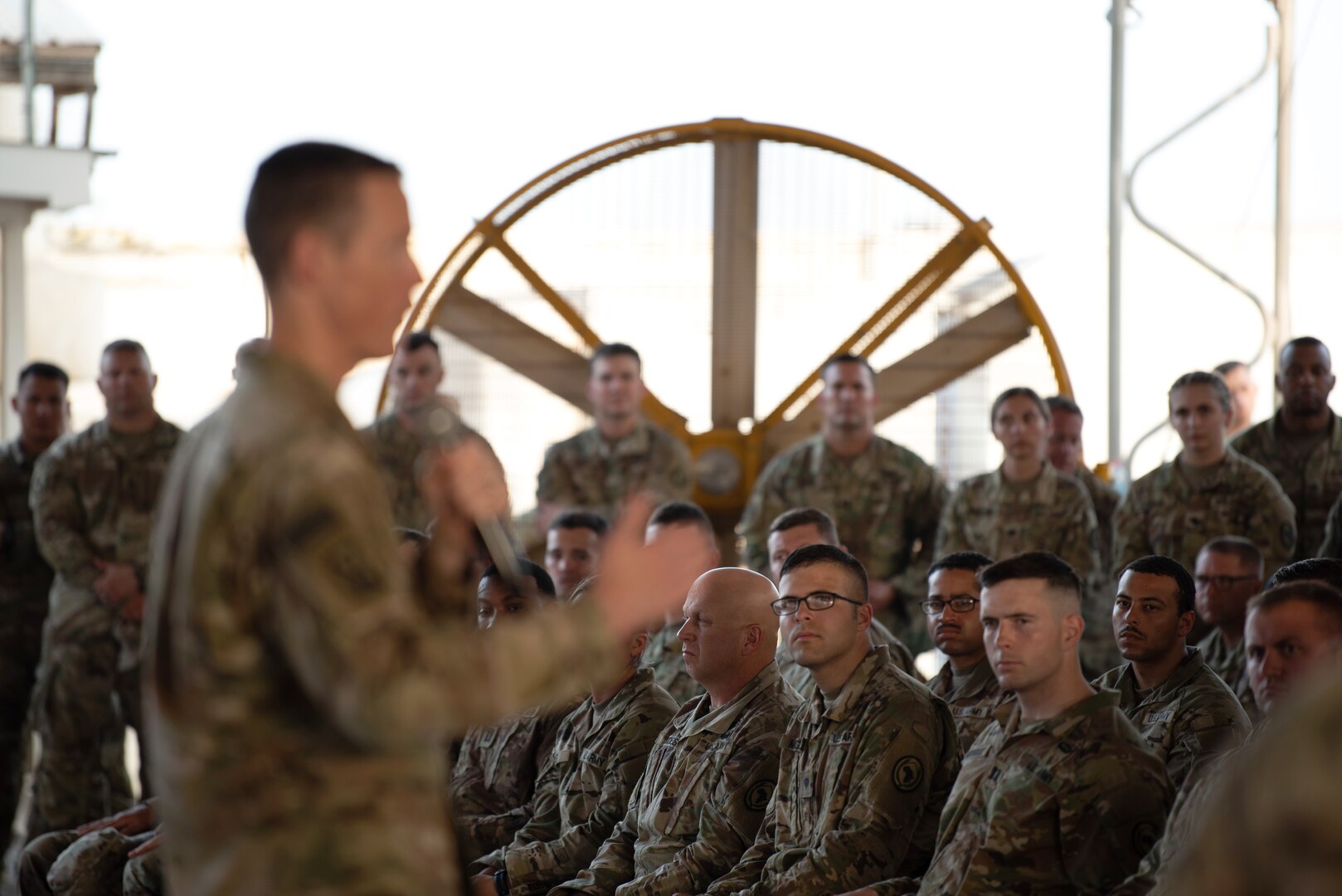 Members of the 404th Maneuver Enhancement Brigade listen to Maj. Gen. William Zana, commanding general of Combined Joint Task Force - Horn of Africa