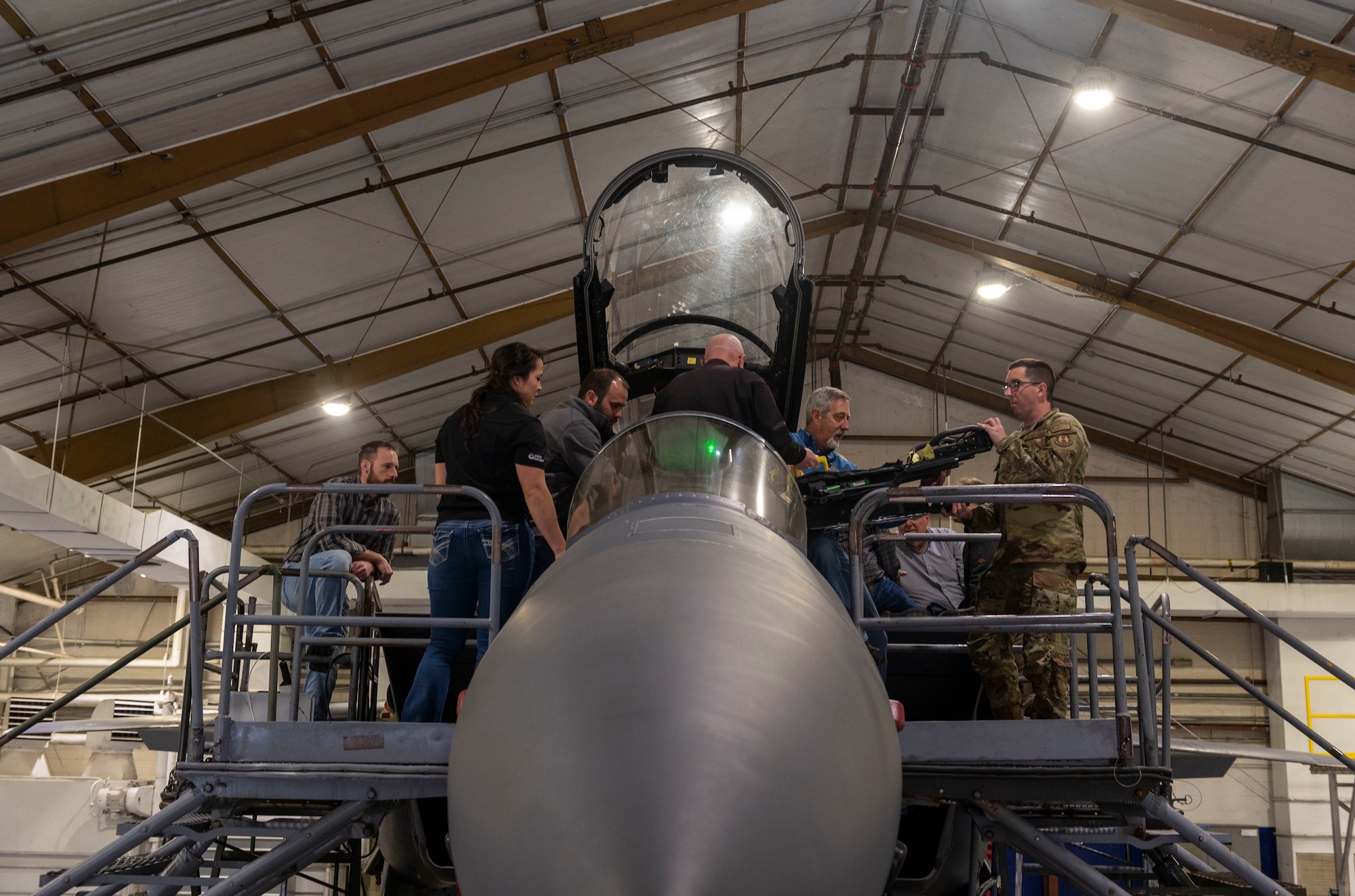 Engineers install modular ejection seat components on an F-15E Strike Eagle at Seymour Johnson Air Force Base, North Carolina, March 14, 2022. The ejection seat comes equipped with a parachute that is larger in diameter for better reliability when deployed.  The Advanced Concept Ejection Seat 5 will replace the F-15E's older ACES II, which is used in many other aircraft in the U.S. Air Force’s arsonal. (U.S. Air Force photo by Senior Airman Kevin Holloway)