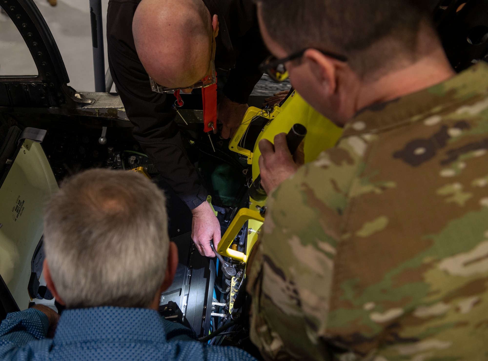 Engineers tighten the modular interaction between seat parts before ejection seat installation on an F-15E Strike Eagle at Seymour Johnson Air Force Base, North Carolina, March 14, 2022. Modular parts of the ejection seat are checked thoroughly to ensure a tight fit in the cockpit. The Advanced Concept Ejection Seat 5 will replace the F-15E's older ACES II, which is used in many other aircraft in the U.S. Air Force’s arsonal. (U.S. Air Force photo by Senior Airman Kevin Holloway)