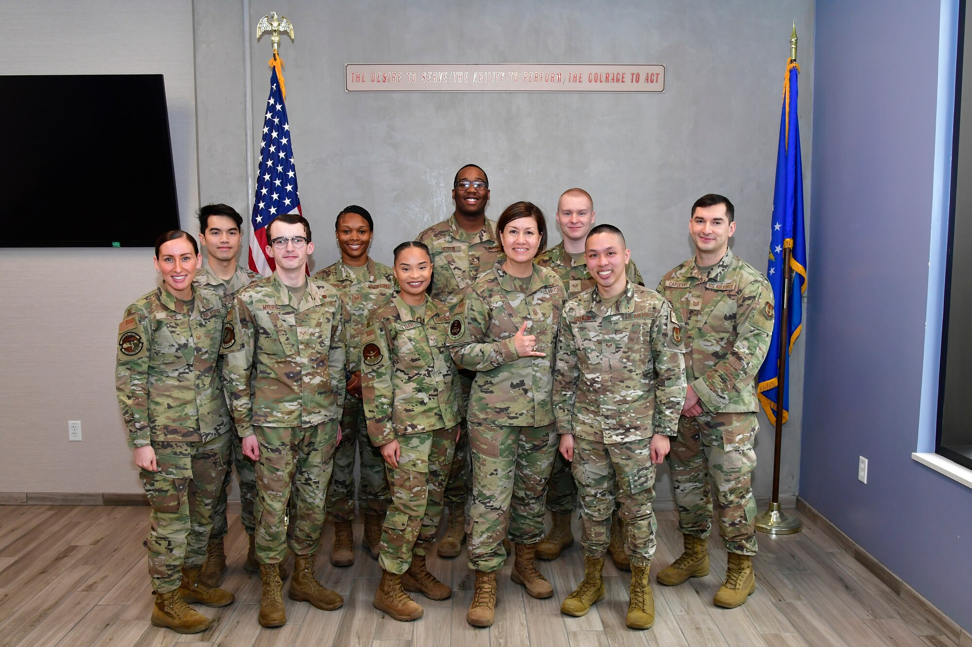 Chief Master Sgt. of the Air Force JoAnne S. Bass stands with outstanding Airmen after recognizing them for their hard work during a base visit at Hill Air Force Base, Utah, March 15, 2022. Left to right: Master Sgt. Darby Jaynes, Senior Airman Meyrick Tan, Senior Airman Tristan Meyers Taylor, Tech. Sgt. Chelsea Lee, Senior Airman Jayauna Tyler, Senior Airman Jamarcus Nelson, Chief Master Sgt. of the Air Force JoAnne S. Bass, Staff Sgt. Cody Vojtko, Staff Sgt. David Valentin, and Tech. Sgt. Marco Cardenas. (U.S. Air Force photo by Todd Cromar)