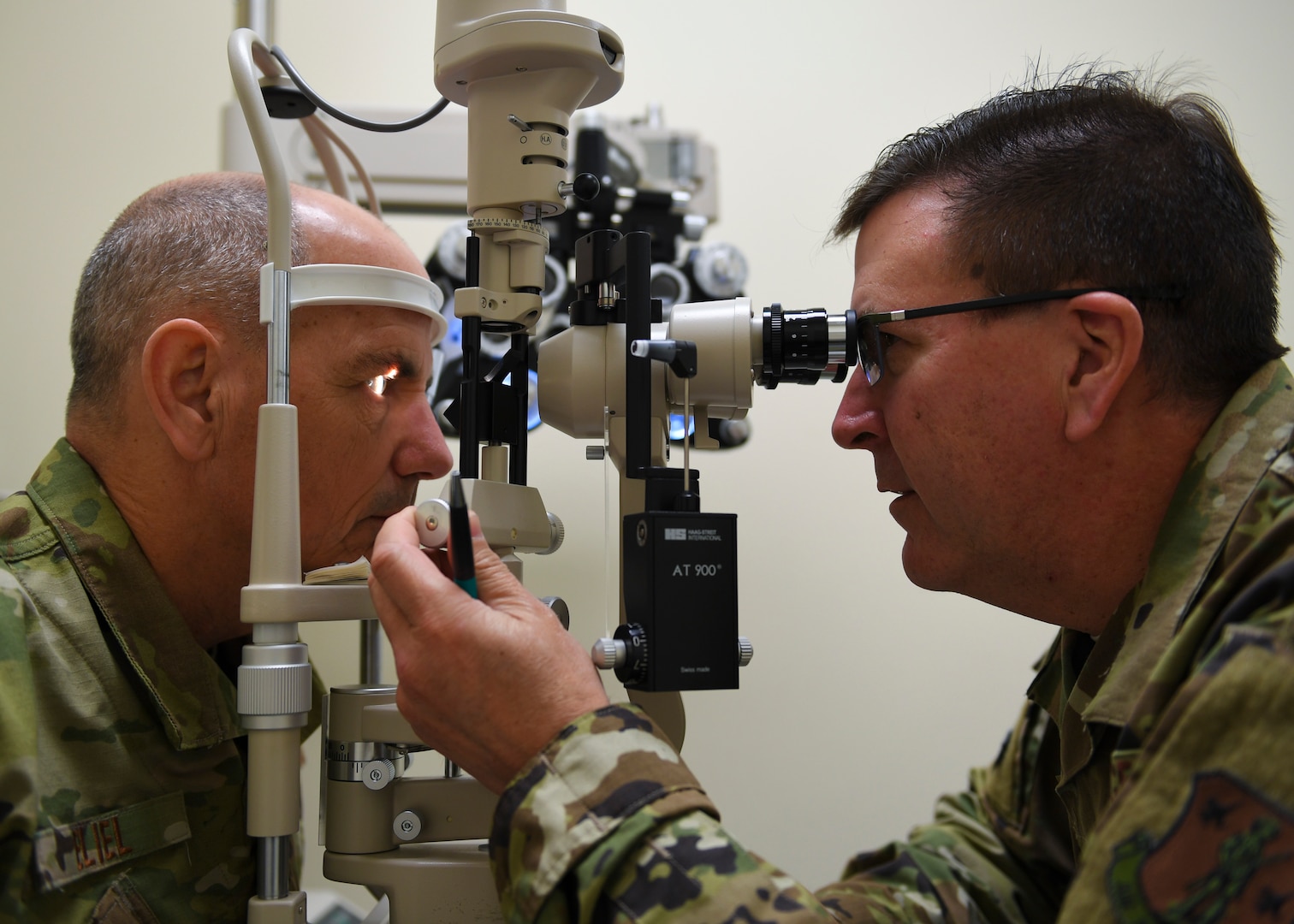 Washington Air National Guard Lt. Col. Robert Forbes, right, 194th Medical Group optometrist, tests Lt. Col. Erik Eliel, 194th Air Support Operations Group director of operations, vision during a 194th Medical Group periodic health assessment rodeo, Camp Murray, Wash., May 4, 2019. The PHA rodeo meets requirements to maintain an Airman’s deployable status by giving immunizations, blood lab draws, HIV screening, and health assessment questionnaires.