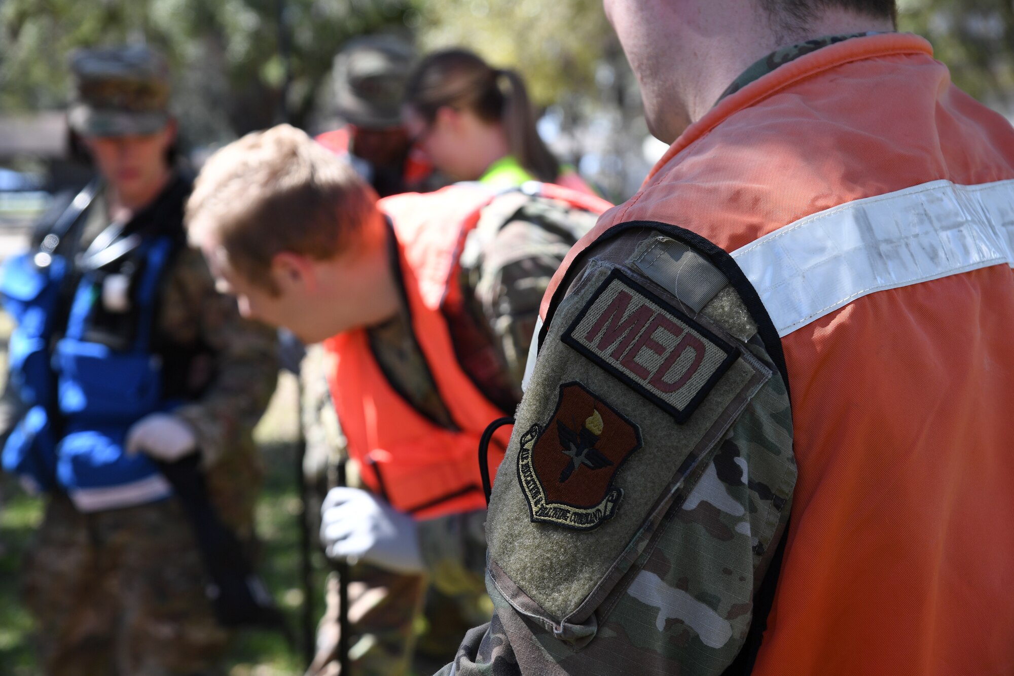 Members of the 81st Medical Group set up a triage area during an Antiterrorism, Force Protection and Chemical, Biological, Radiological, Nuclear exercise at Keesler Air Force Base, Mississippi, March 17, 2022. The exercise tested the base's ability to respond to and recover from a mass casualty event. (U.S. Air Force photo by Kemberly Groue)