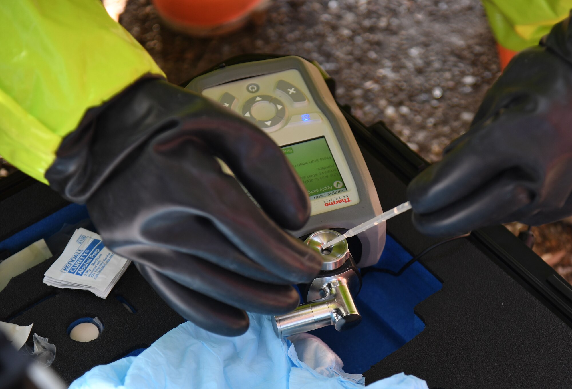 Chris Butler, 81st Civil Engineering Squadron emergency management logistics specialist, tests a chemical substance during an Antiterrorism, Force Protection and Chemical, Biological, Radiological, Nuclear exercise at Keesler Air Force Base, Mississippi, March 17, 2022. The exercise tested the base's ability to respond to and recover from a mass casualty event. (U.S. Air Force photo by Kemberly Groue)