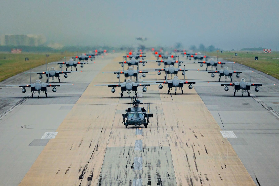 Aircraft line up in formation.