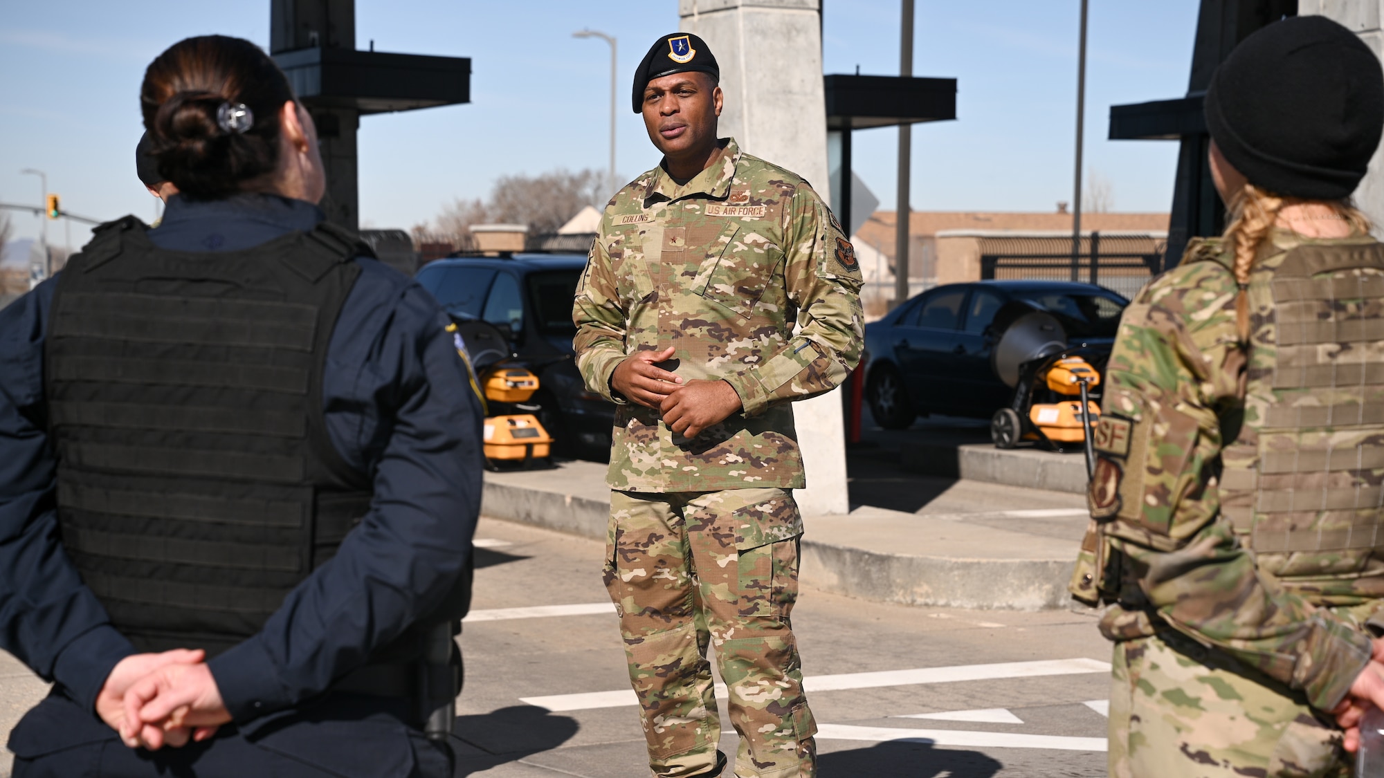 Brig. Gen. Roy Collins speaks to airmen standing at parade rest.