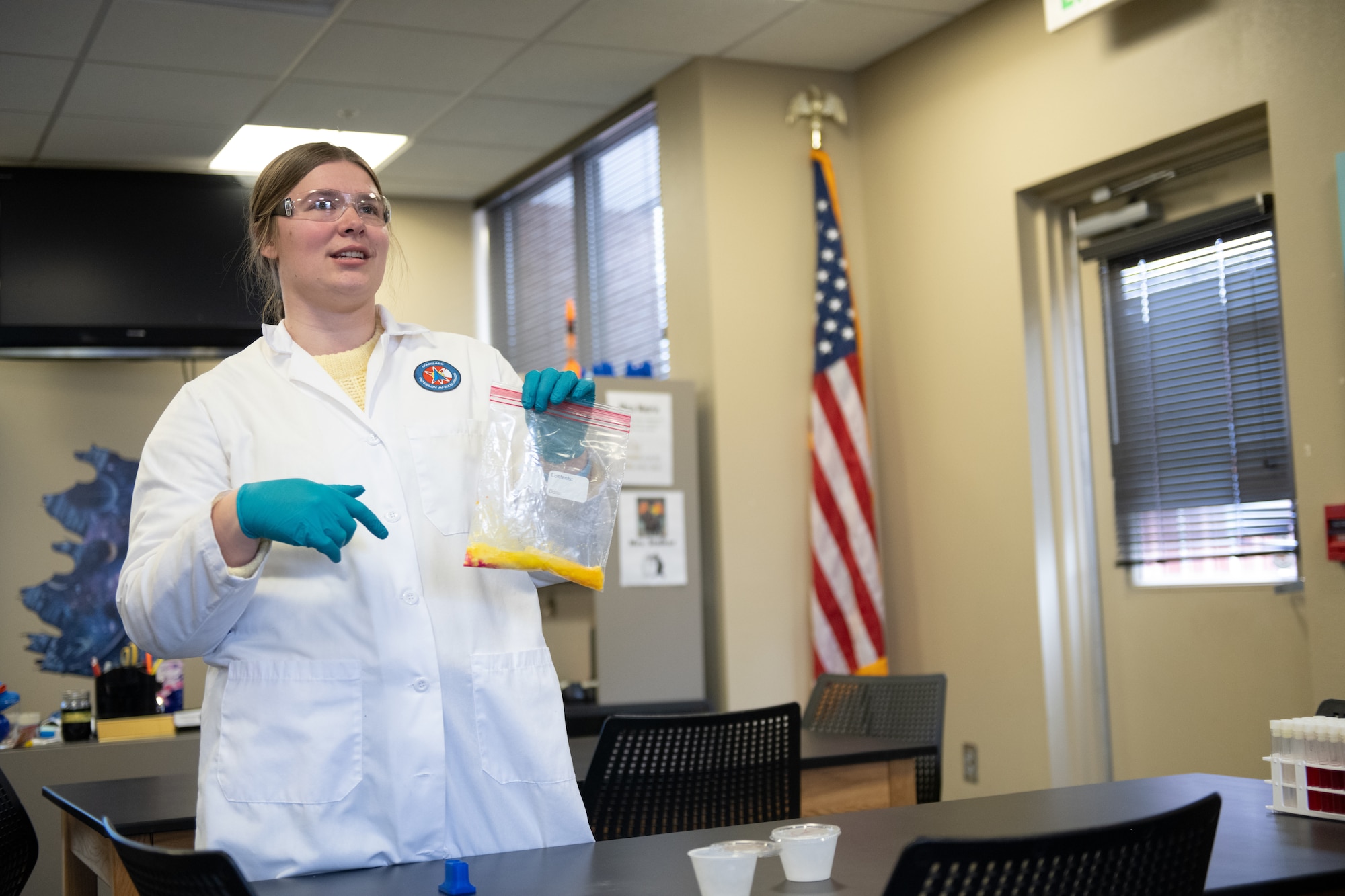 Woman performs chemical reaction