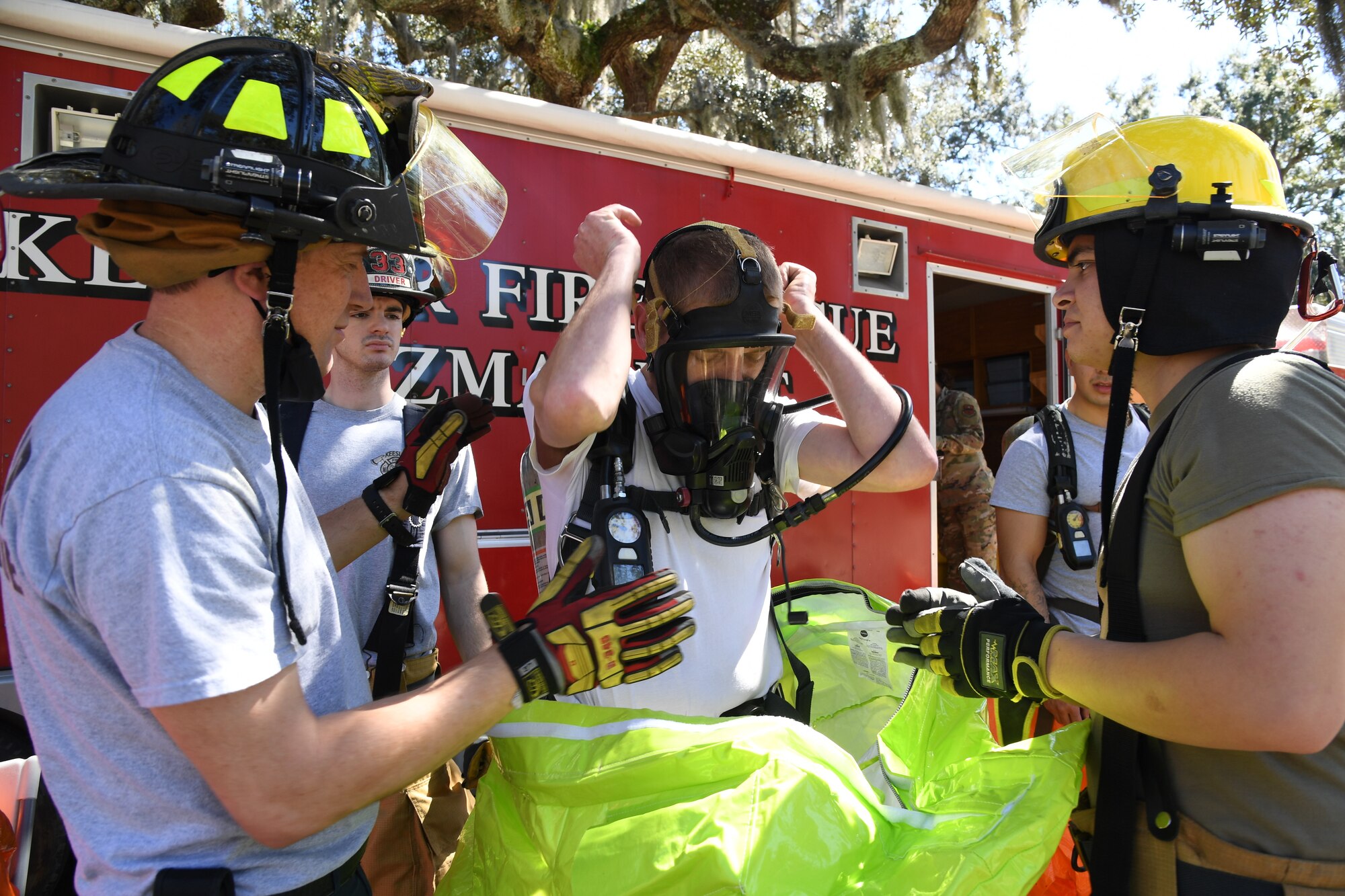 Keesler first responders prepare to enter the contaminated area during an Antiterrorism, Force Protection and Chemical, Biological, Radiological, Nuclear exercise at Keesler Air Force Base, Mississippi, March 17, 2022. The exercise tested the base's ability to respond to and recover from a mass casualty event. (U.S. Air Force photo by Kemberly Groue)