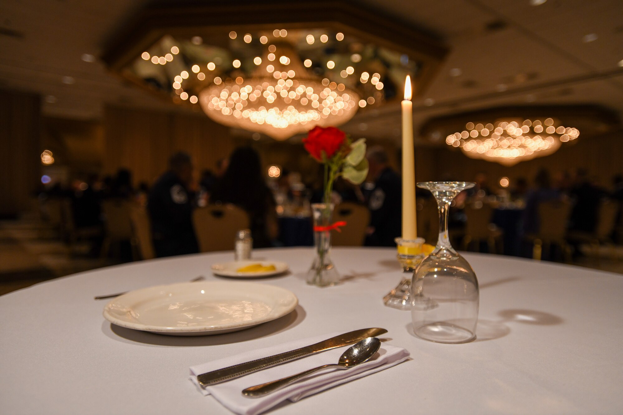 An empty table sits in remembrance in honor of all prisoners of war and service members missing in action during a Chief Recognition Ceremony at Martin’s Crosswinds in Greenbelt, Md., March 18, 2022.