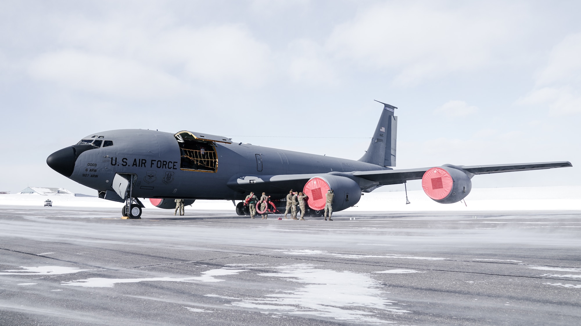 Maintainers assigned to the 6th Maintenance Group place engine covers on a KC-135 Stratotanker aircraft assigned to the 6th Air Refueling Wing after landing on the flight line during North American Aerospace Defense Command's (NORAD) Operation Noble Defender (OND), March 15, 2022.