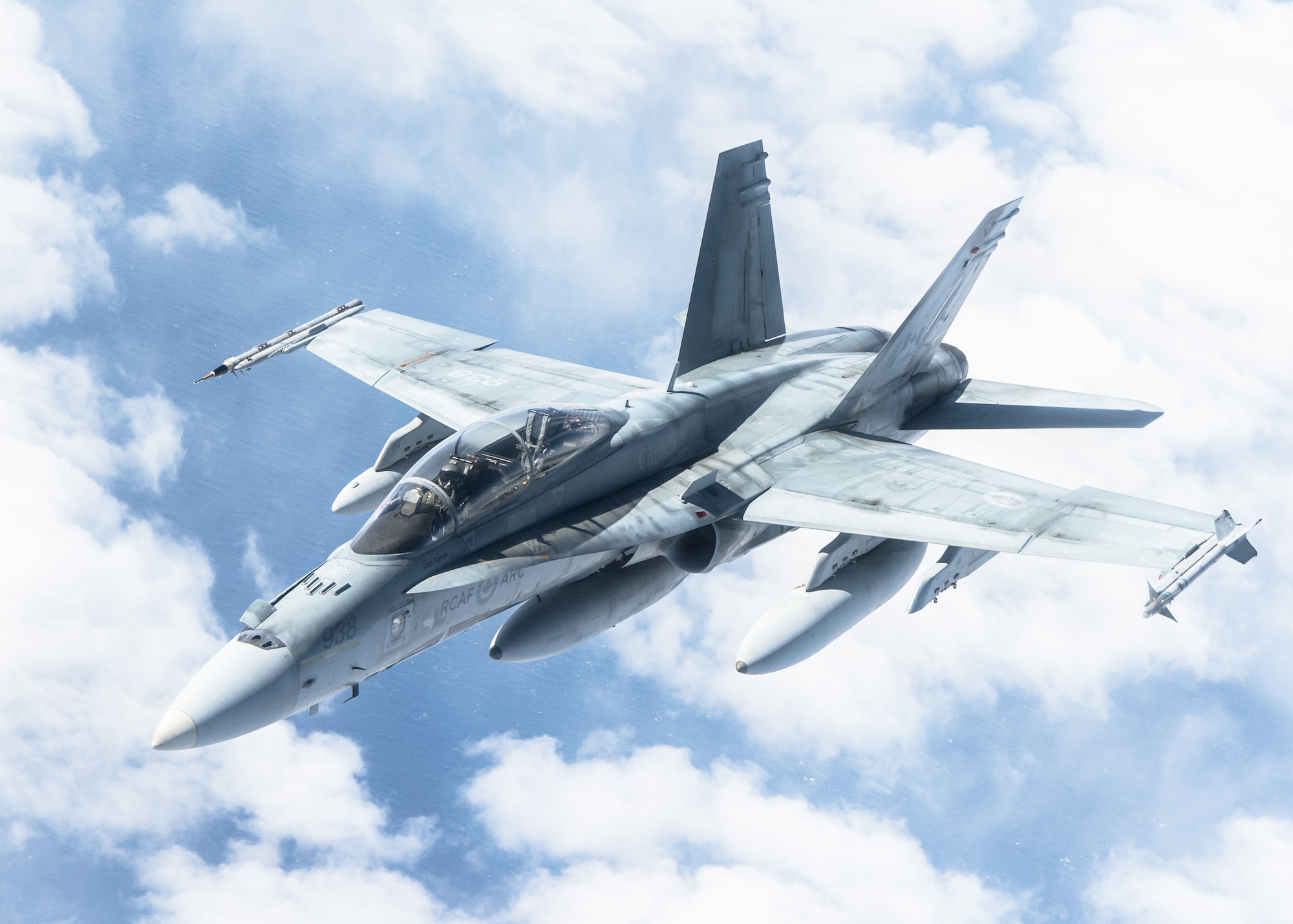 A CF-18 Hornet aircraft assigned to the 433rd Tactical Fighter Squadron flies away after receiving aerial refueling from a KC-135 Stratotanker aircraft assigned to the 6th Air Refueling Wing in support of North American Aerospace Defense Command's (NORAD) Operation Noble Defender (OND), March 16, 2022.