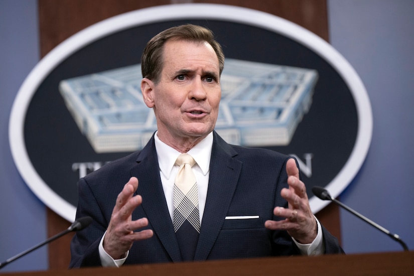 A man speaks at a podium.