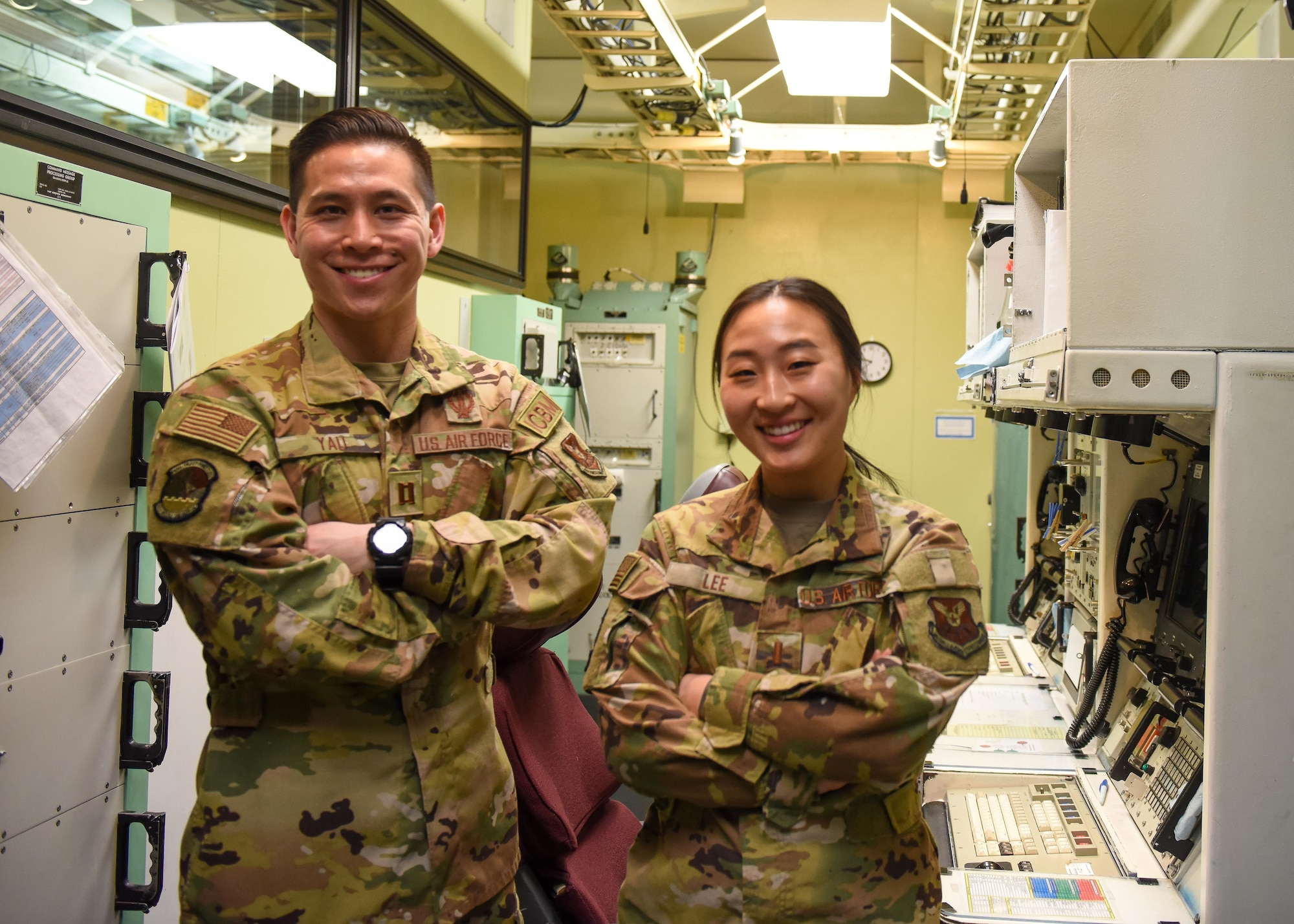 Missileers sit at a control console