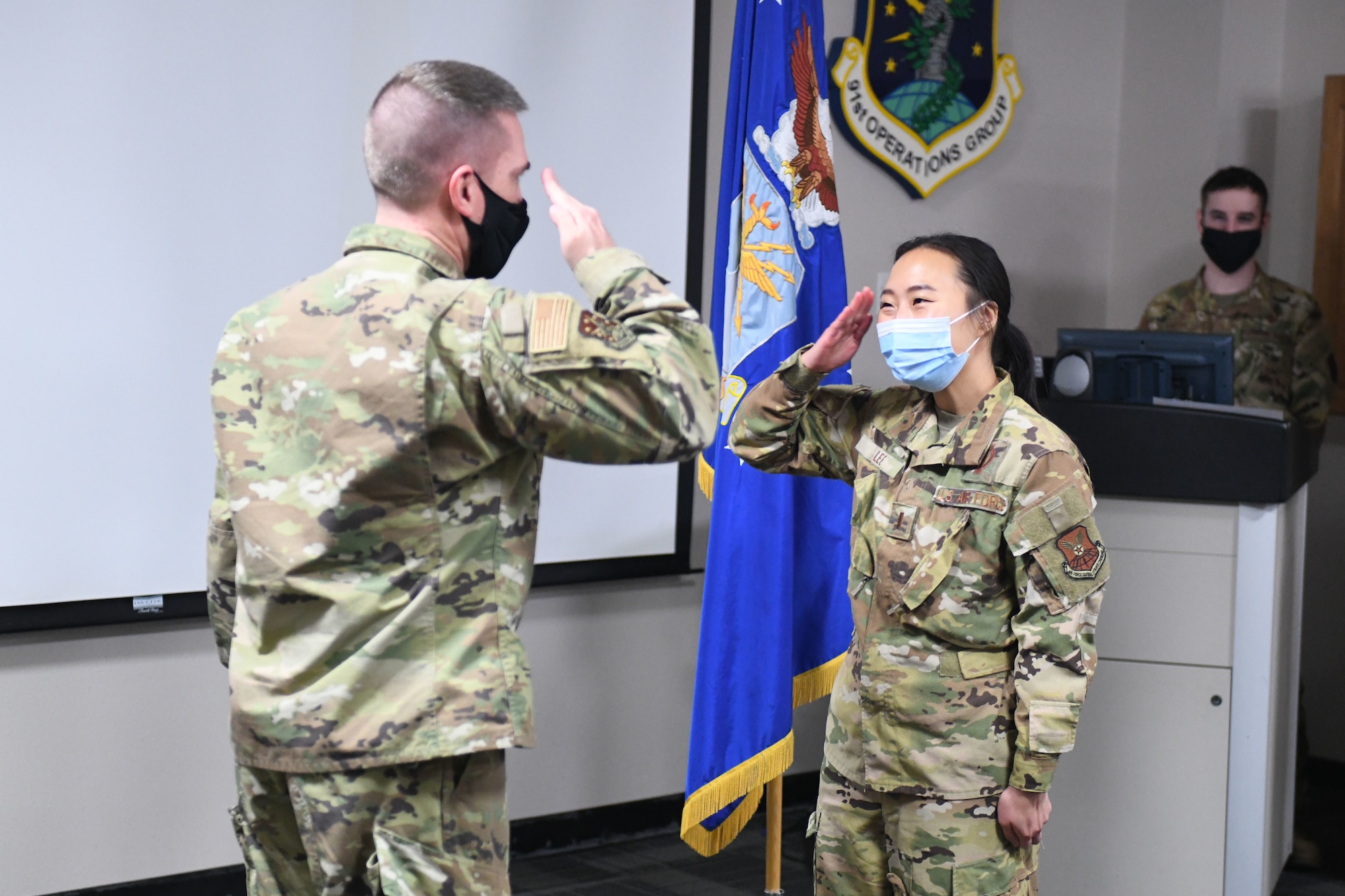 Missileers sit at a control console