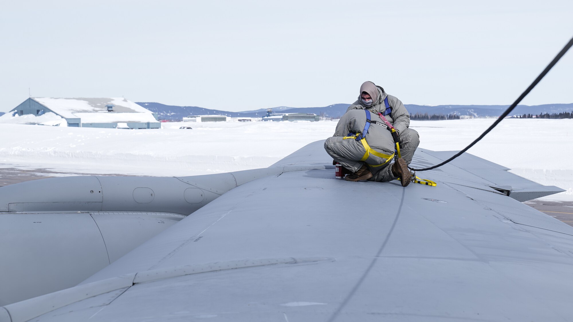 Airmen assigned to the 6th Maintenance Squadron service a hydraulic system on a KC-135 aircraft assigned to the 6th Air Refueling Wing during North American Aerospace Defense Command's (NORAD) Operation Noble Defender (OND), March 16, 2022.