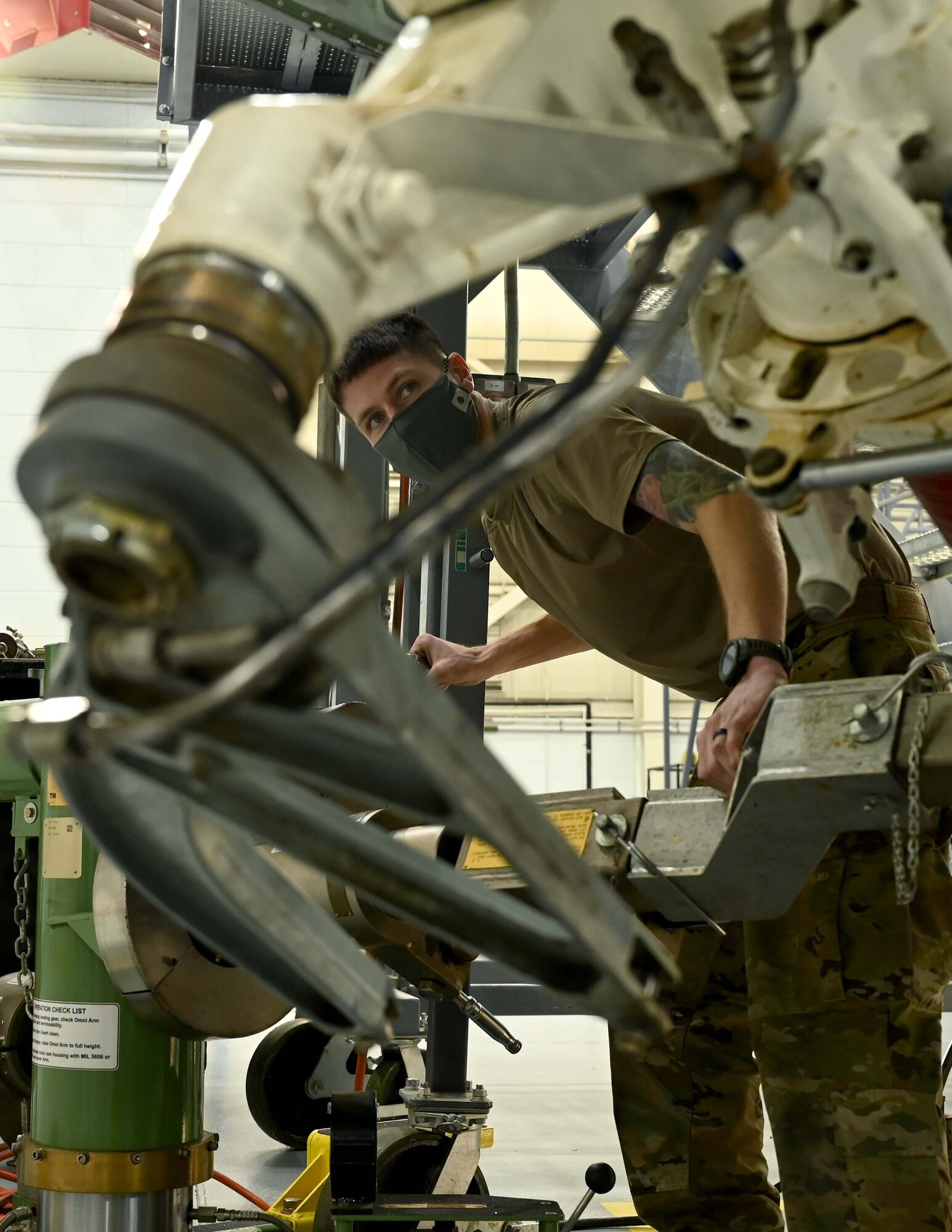 a man uses equipment to remove landing gear