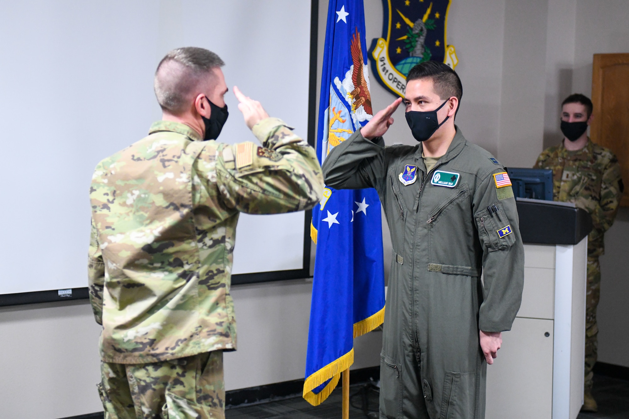 Missileers sit at a control console