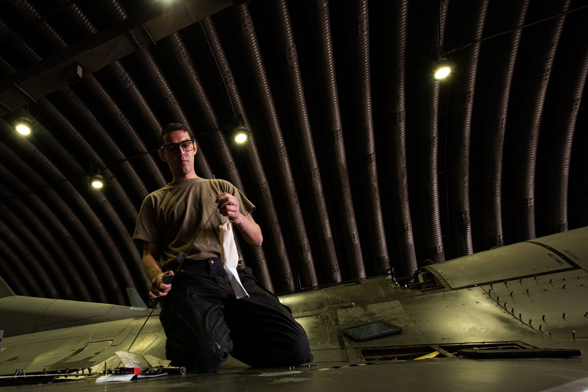 Staff Sgt. Armando Sutton, 36th Aircraft Maintenance Unit, F-16 Fighting Falcon dedicated crew chief, works on an F-16 at Osan Air Base, Republic of Korea, March 17, 2022.