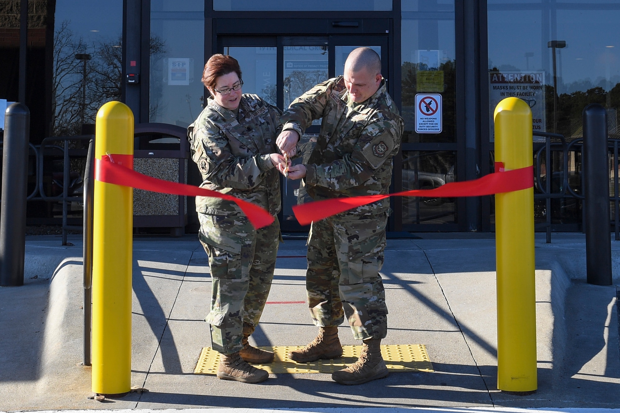 Lt. Col. Valerie O'Brien, 19th Healthcare Operations Squadron commander, and Chief Master Sgt. Jason Amaxopulos, 19th MDG senior enlisted leader, cut a ribbon to signify the launch of MHS GENESIS